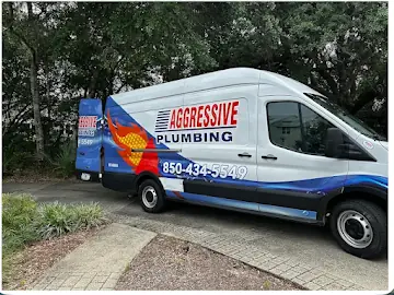 Aggressive Plumbing service van parked at a Pensacola job