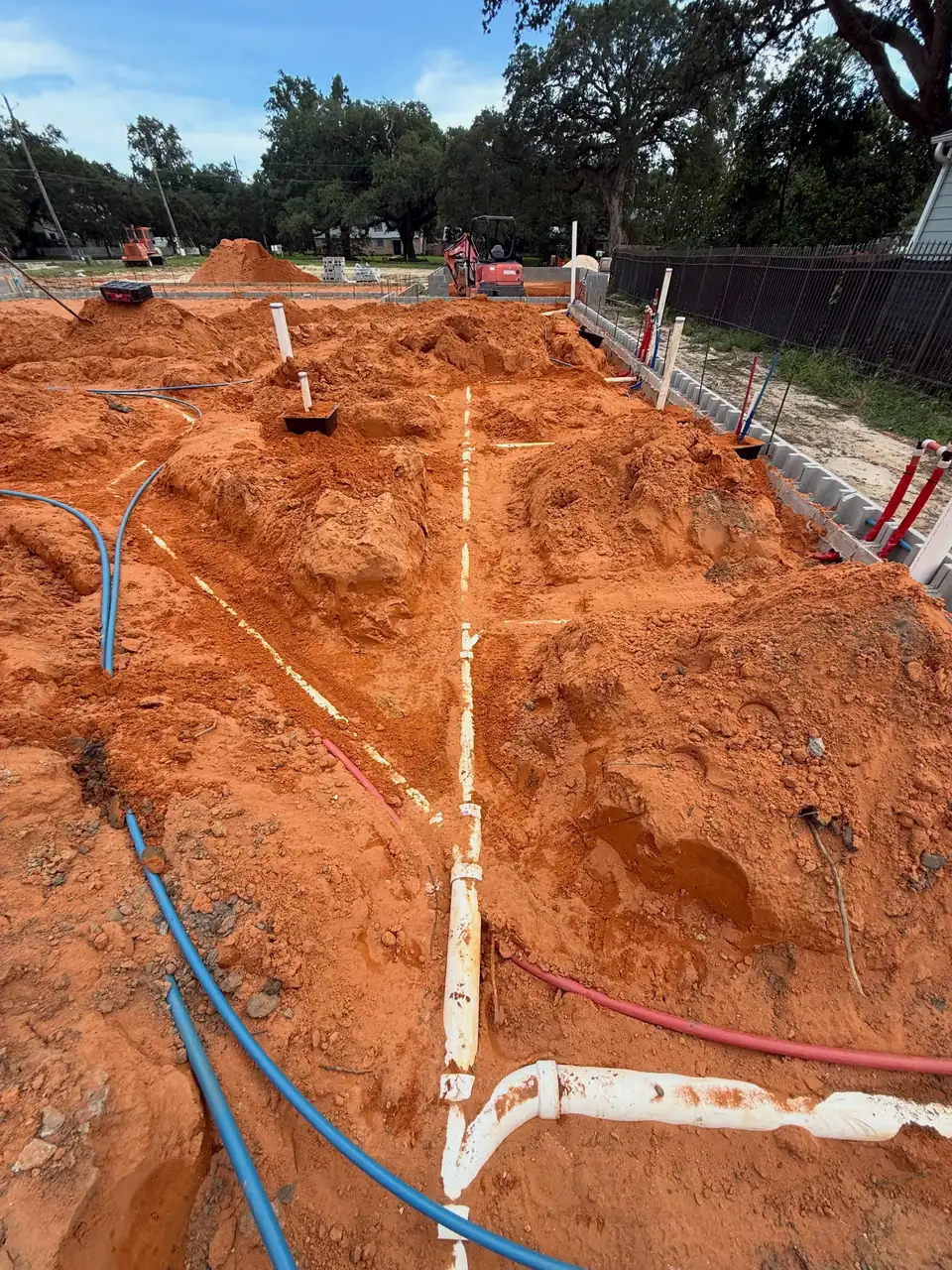 New construction plumbing rough-in in red clay