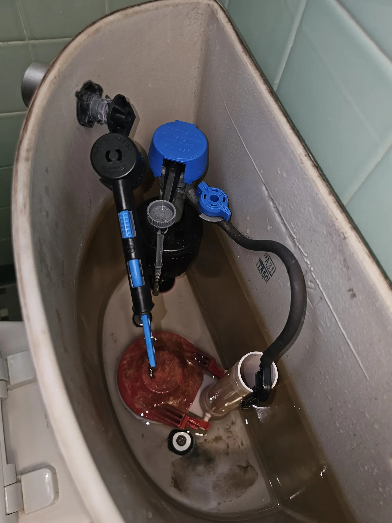 New adjustable toilet fill valve installed in a tank
