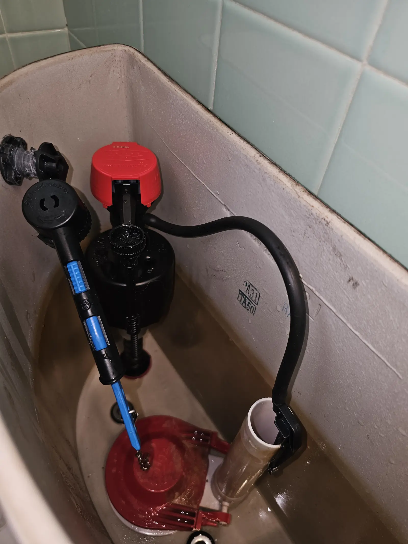 Toilet tank with fill valve and flapper service